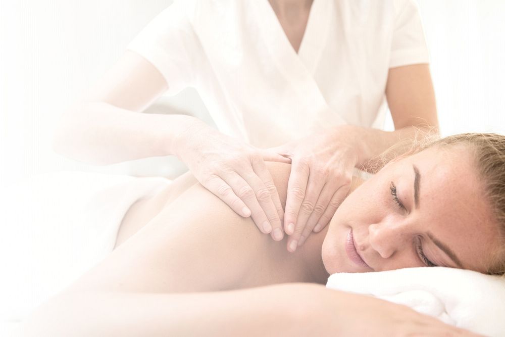 Woman having massage, spa retreat