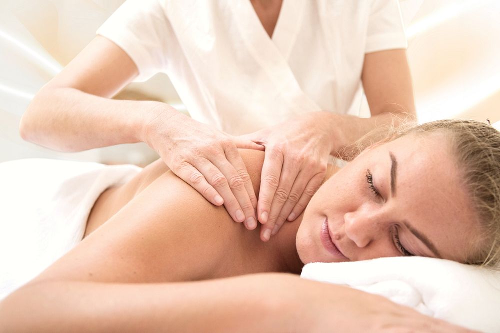 Woman having massage, spa retreat