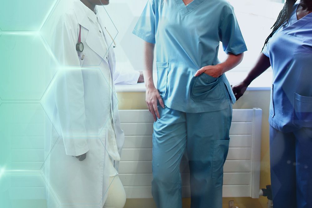Group of medical professionals discussing in the hallway of a hospital