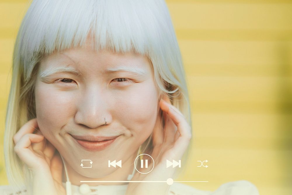 Cute albino girl listening to her favorite music through earphones remix