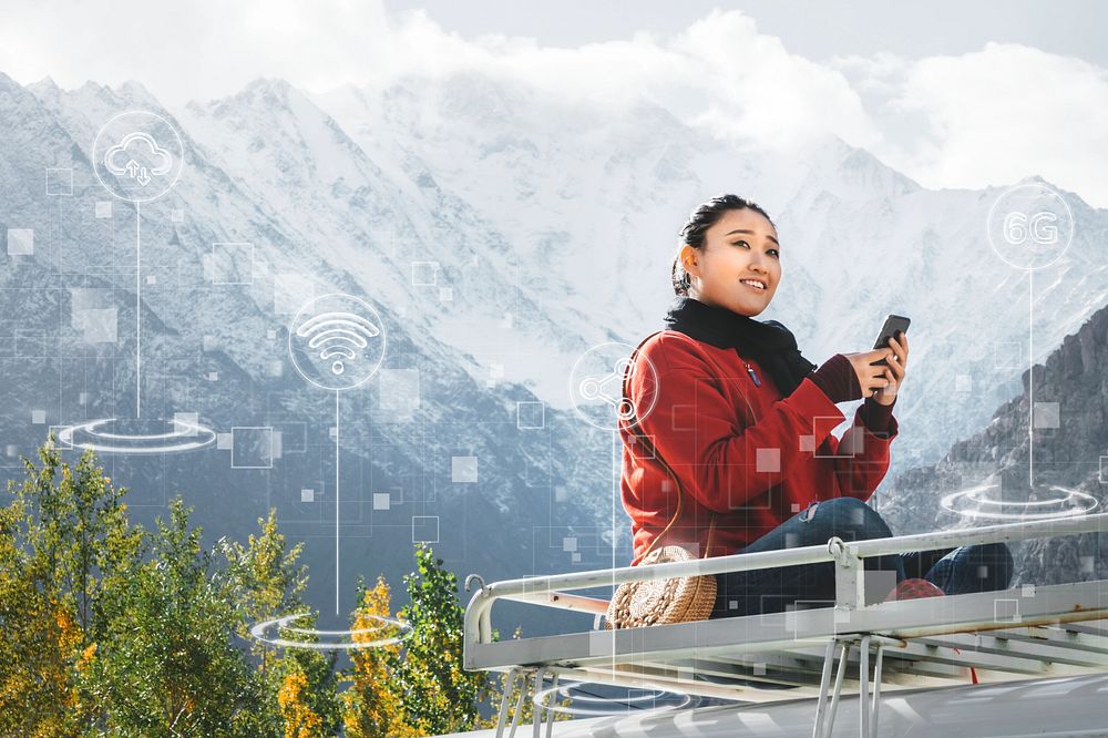 Woman using a smartphone in the Himalaya mountains
