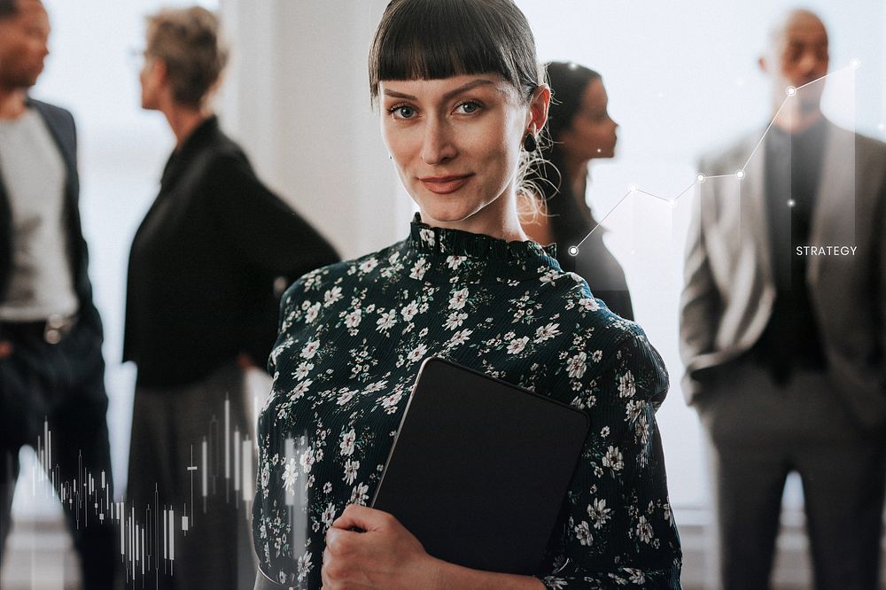 Confident businesswoman standing with a digital tablet
