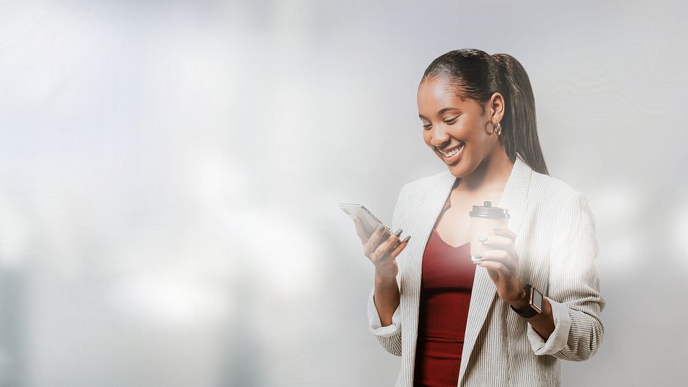 Happy woman in a blazer with a phone
