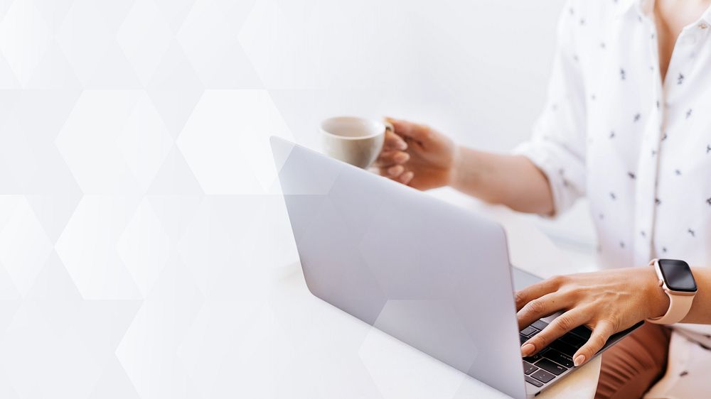 Businesswoman drinking coffee while working at home