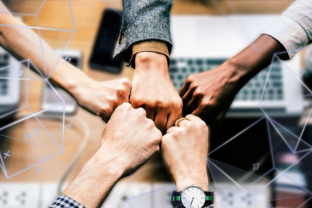 Diverse colleages giving a fist bump