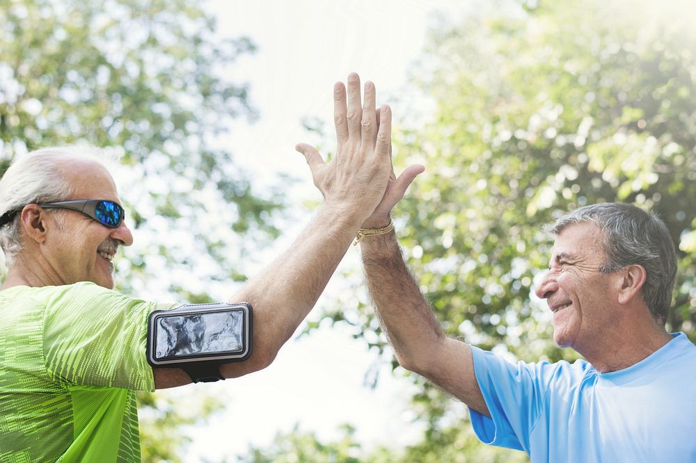 Senior adults giving a high five