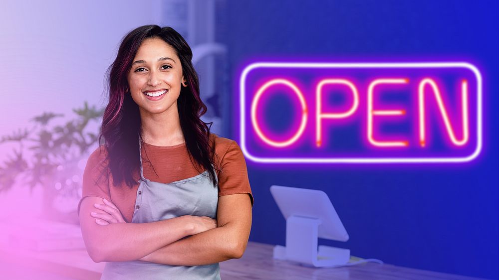 Smiling female small business owner at a cash register