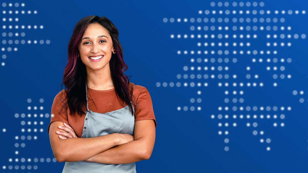 Smiling female small business owner at a cash register