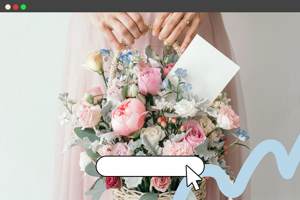 Hand carrying a basket filled with assorted colorful flowers and a note card
