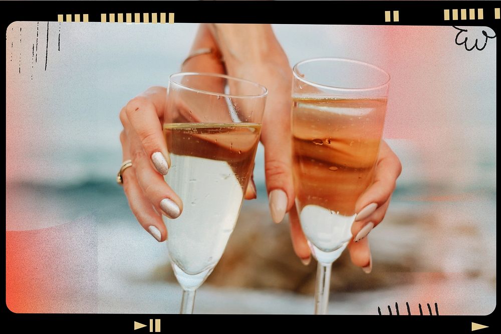 Women with glasses of champagne at the beach
