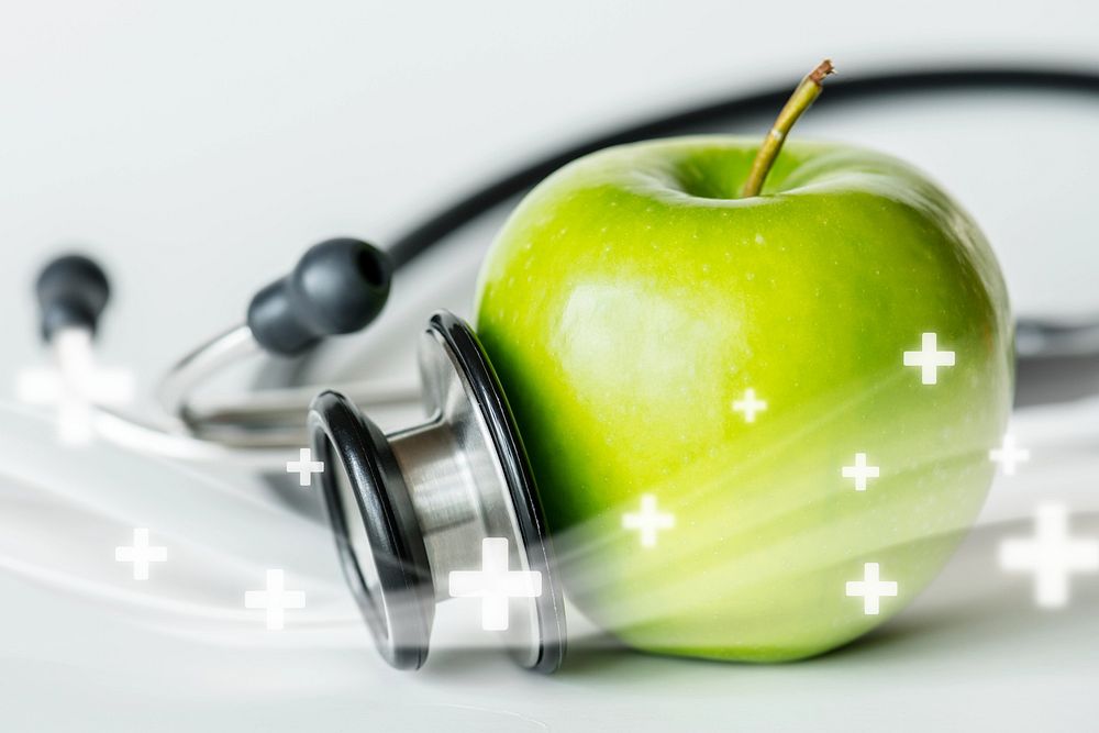 Closeup of an apple and a stethoscope remix
