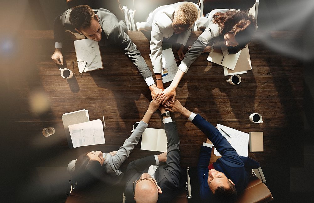 Business people are joining hands together