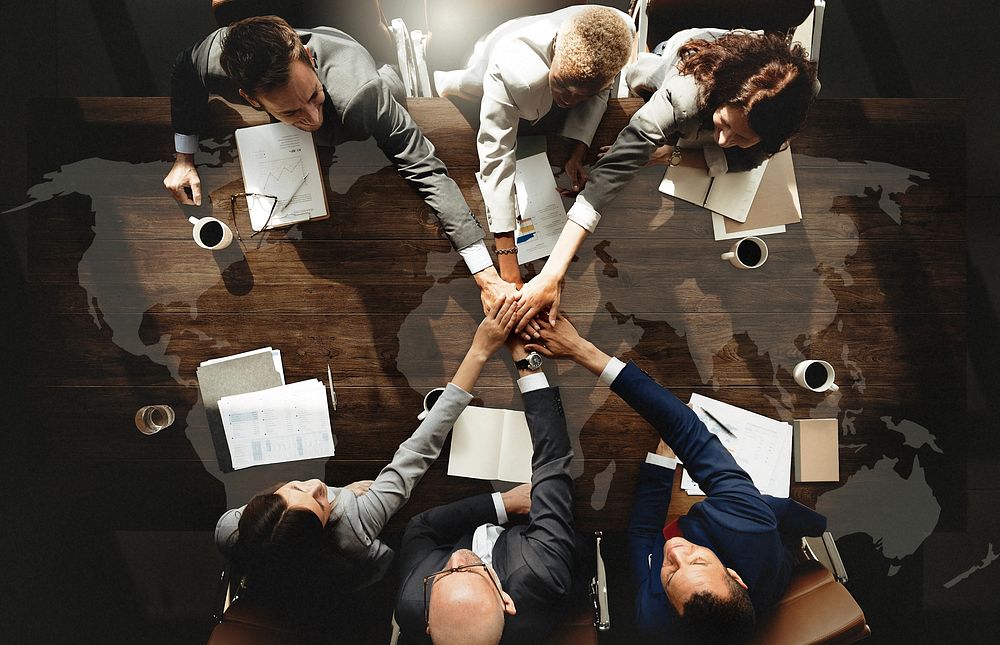 Business people are joining hands together