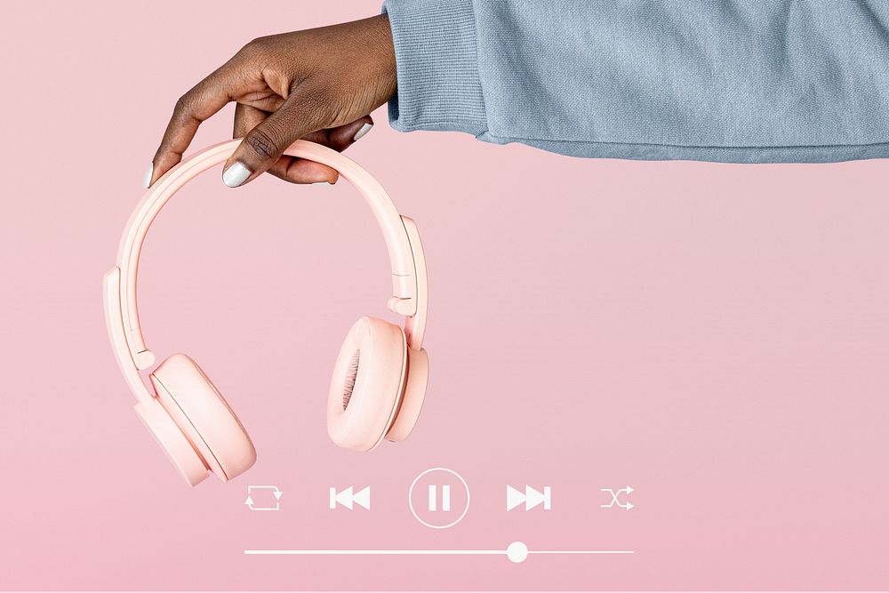 Hand holding pink headphones remix