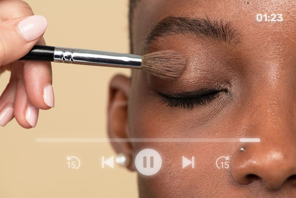 Makeup artist applying eye shadow on a black woman remix