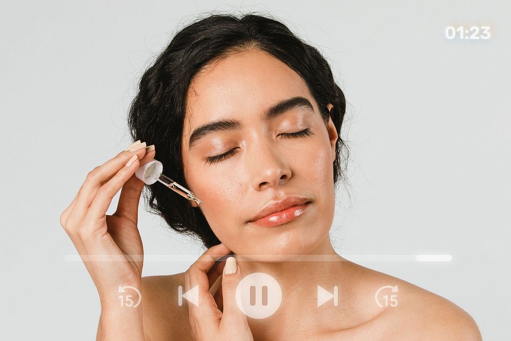 Young woman applying serum on her face remix