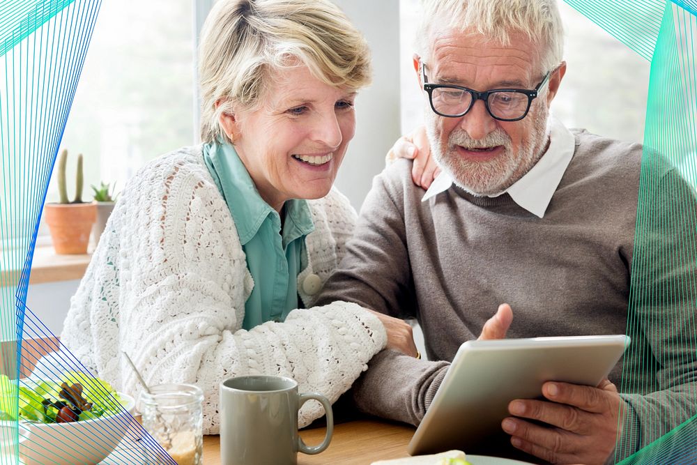 Happy senior couple using tablet remix