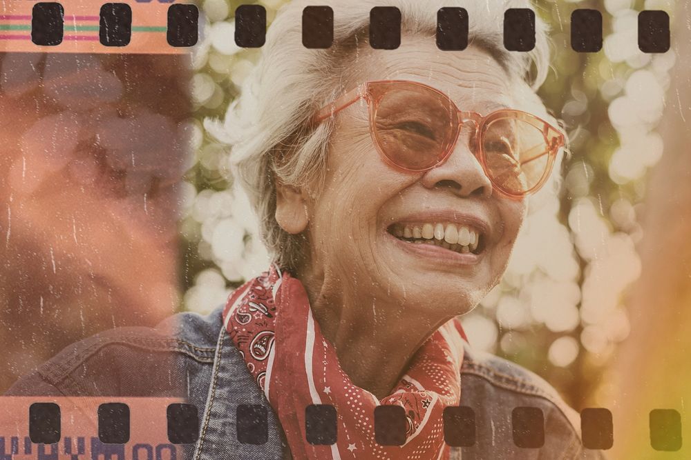 A cheerful female elderly in denim jacket