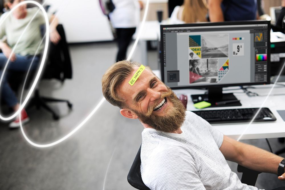Be happy note on a bearded office workers forehead