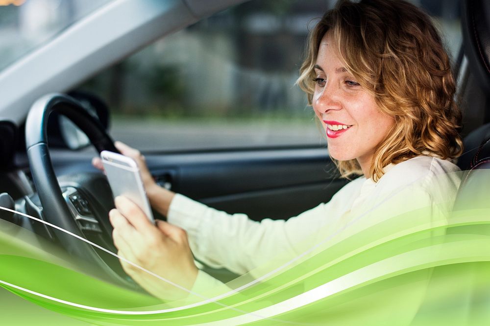 Woman using mobile phone while driving