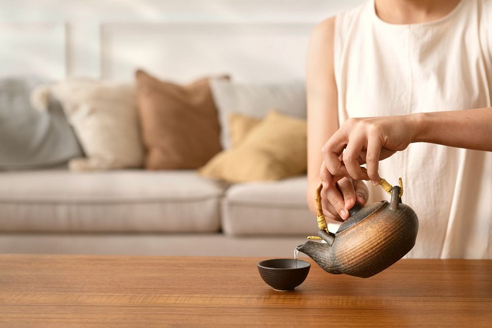 Japanese woman preparing matcha green tea