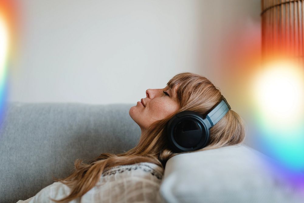 Woman listening to music at home