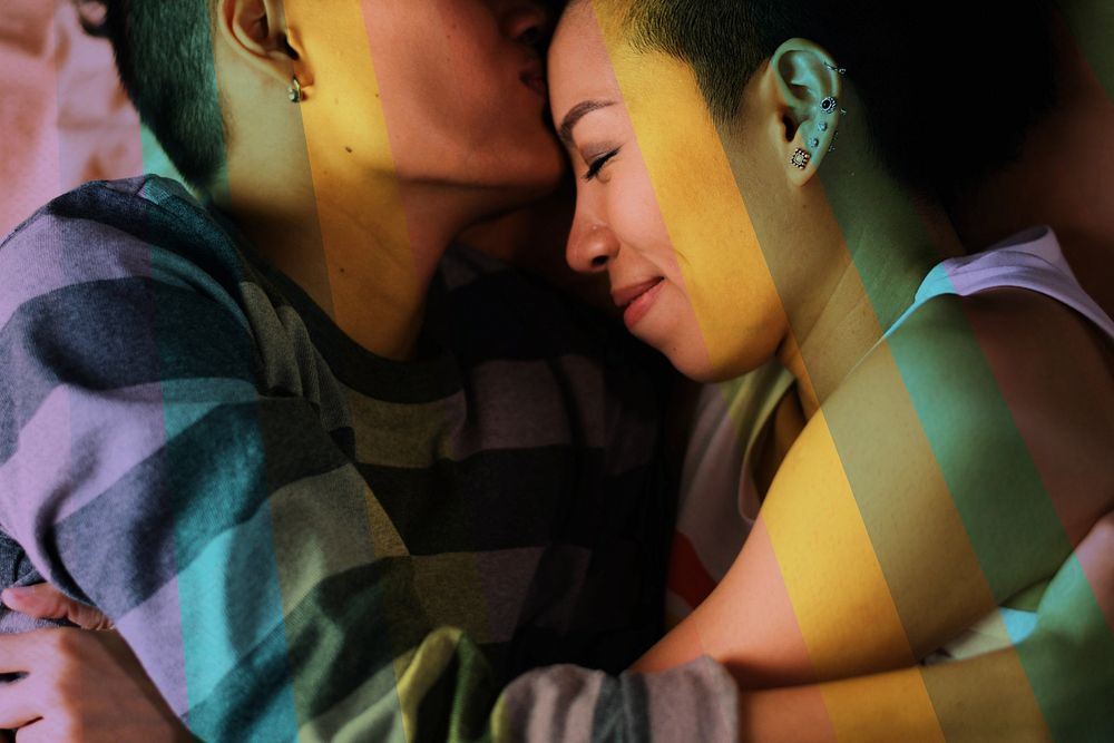 Happy asian lesbian couple embracing
