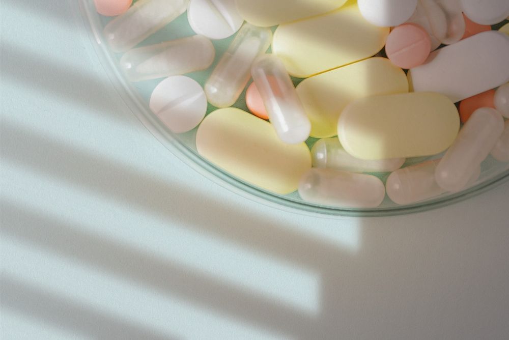 Colorful tablets in a bowl flatlay