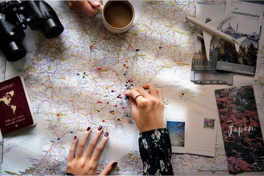 Woman using map to plan a trip