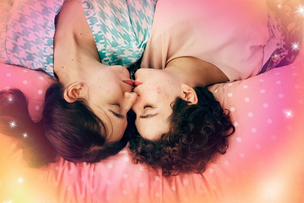 Lesbian couple sleeping on the bed together