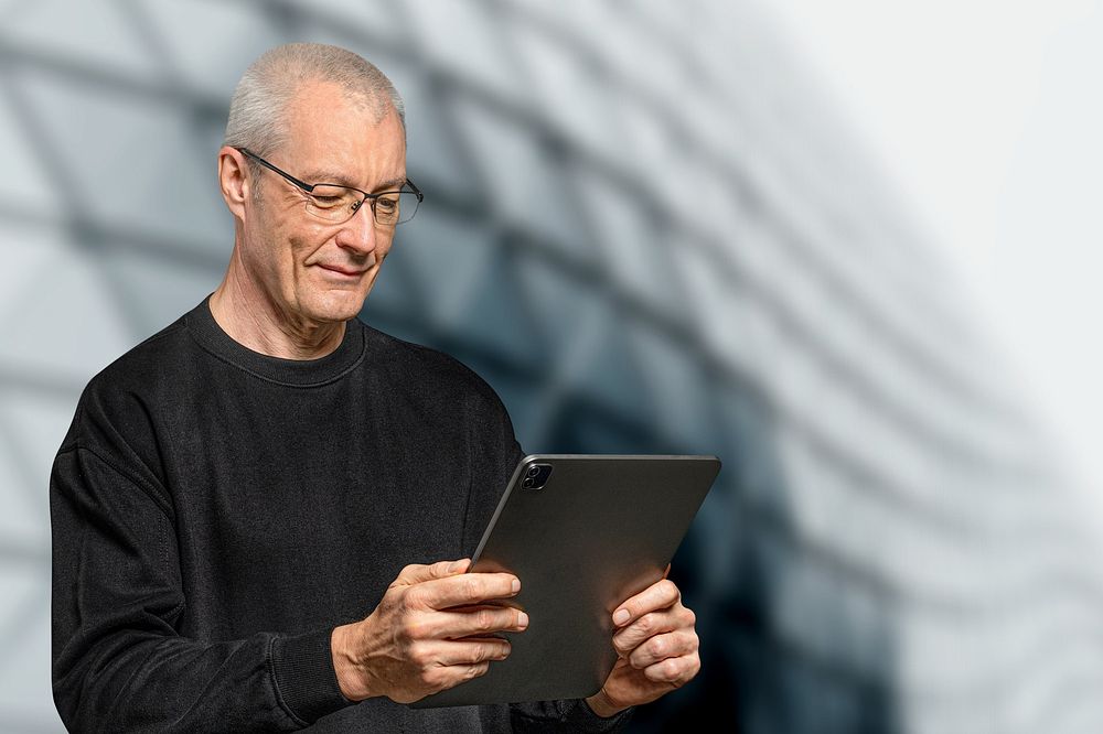 Senior businessman using tablet remix
