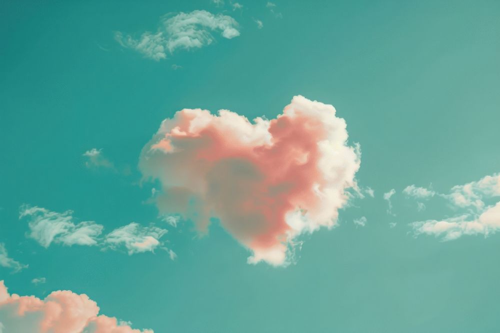 Heart shaped as a clouds in the clear sky background outdoors nature symbol.
