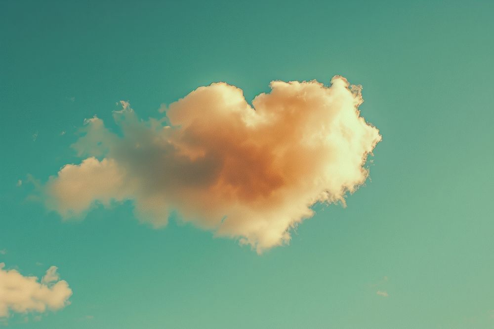 Heart shaped as a clouds in the clear sky background outdoors cumulus weather.