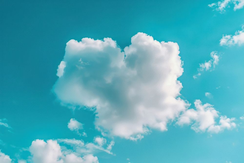Heart shaped as a clouds in the clear sky background outdoors nature azure sky.