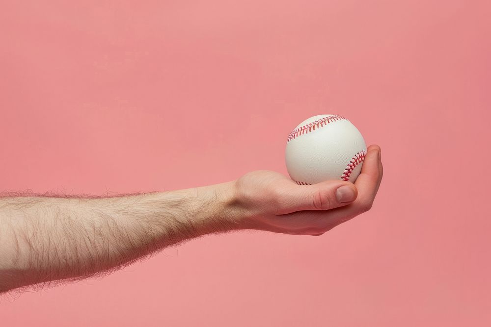 Baseball ball on hand softball clothing apparel.