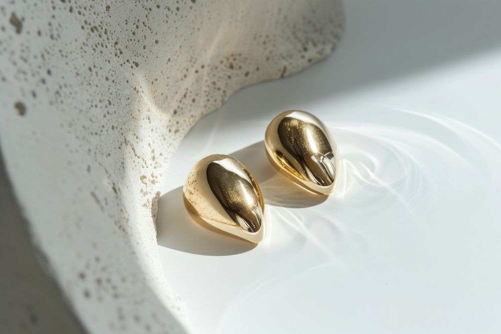 Gold earrings invertebrate accessories accessory.