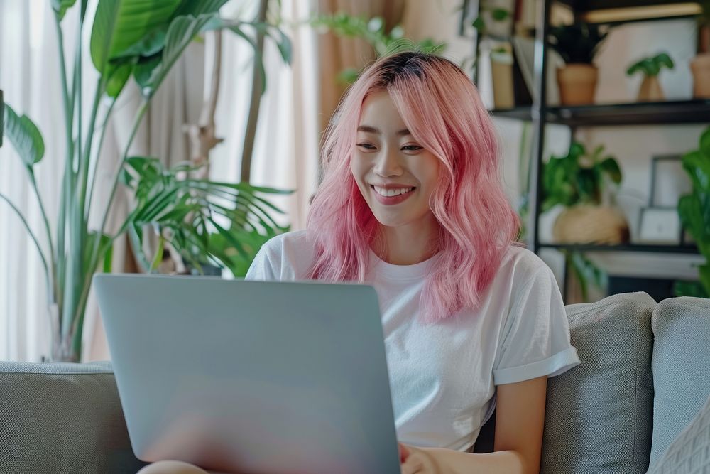 Young Asian woman laptop plant hair.