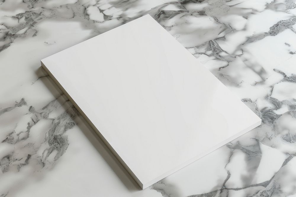 Closeup photo of a blank a4 paper mockup publication indoors floor.