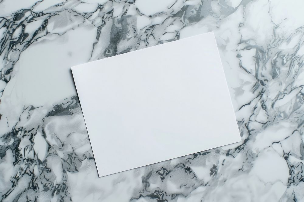 Closeup photo of a blank a4 paper mockup marble floor text.