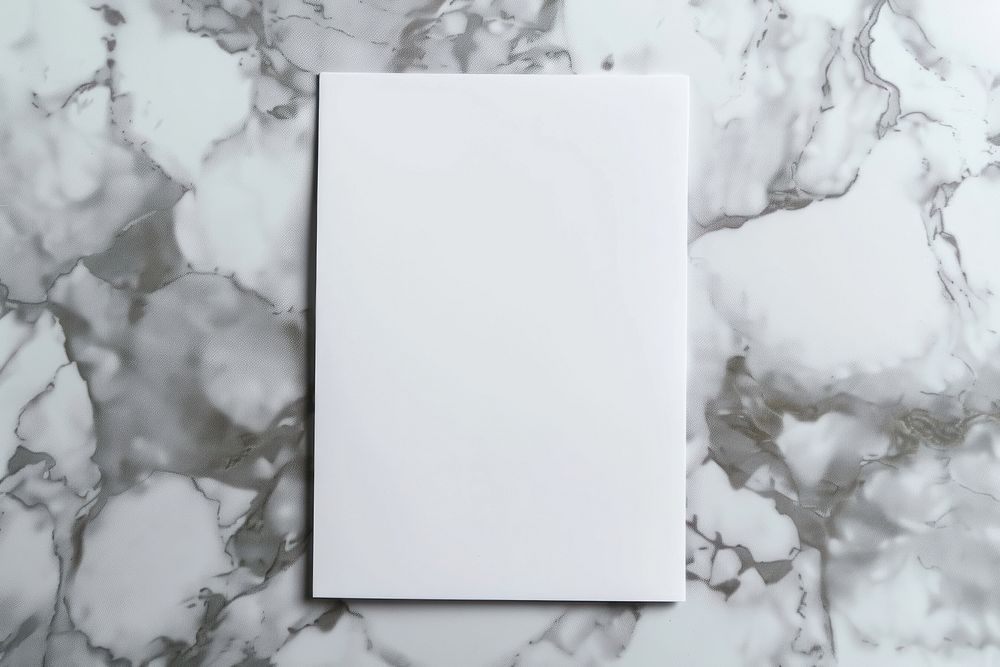Closeup photo of a blank a4 paper mockup marble white board.