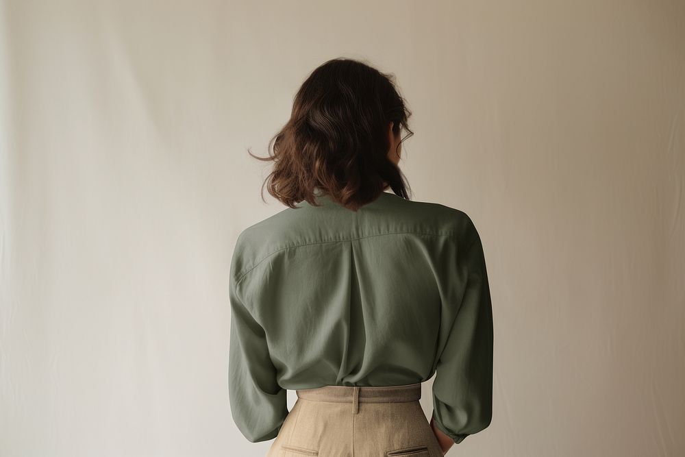 Woman in green blouse rear view