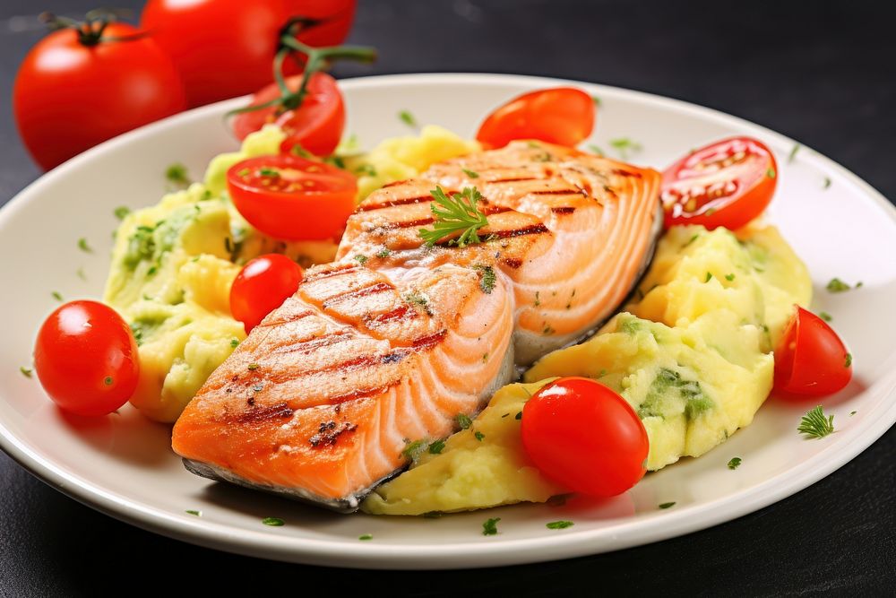 Scrambled eggs with sear salmon steak and avocado plate food seafood.