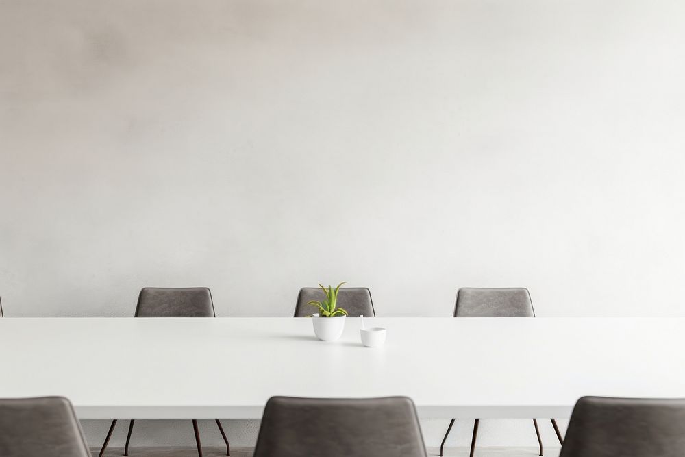 Empty white concrete wall mockup of office room meeting room furniture.