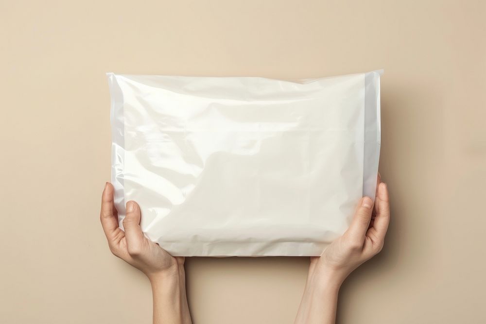 A white plastic mailing bag mockup cushion pillow diaper.