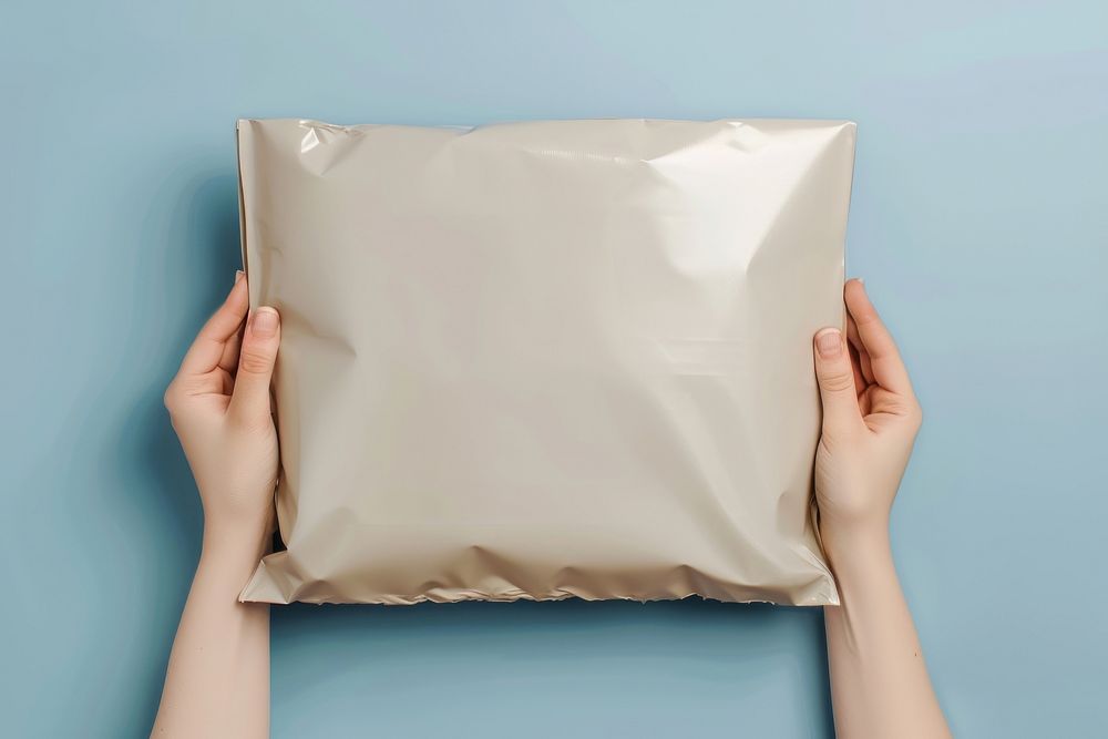 A white plastic mailing bag mockup aluminium cushion pillow.