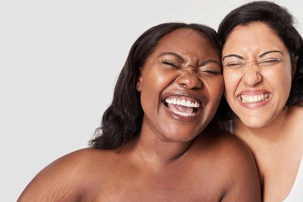 Two body positivity women laughing