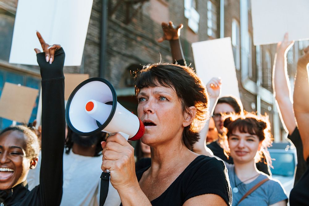 Feminist with a megaphone at a protest psd