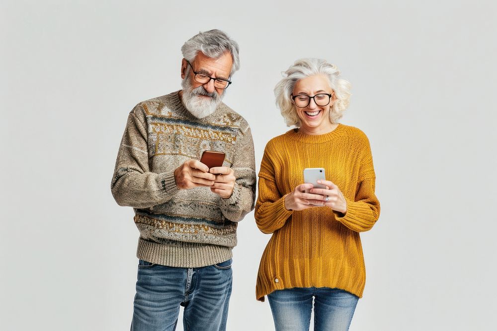 Seniors using smartphones smiling