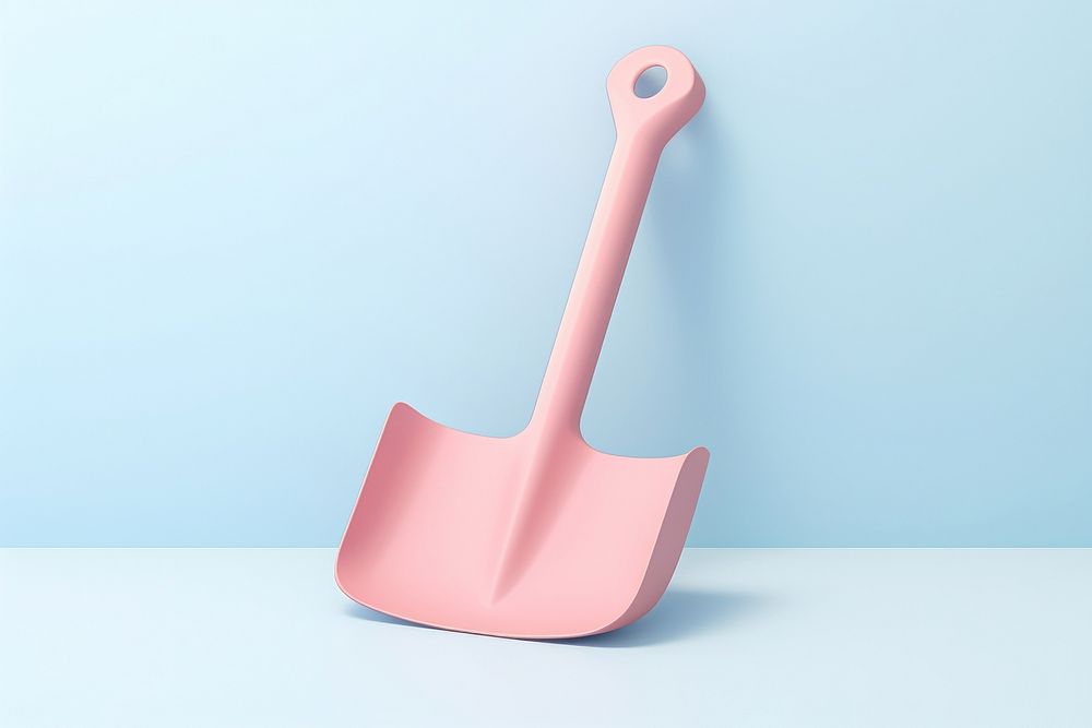 Pink plastic shovel against blue