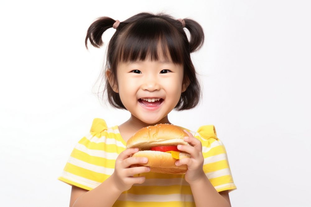 Happy child enjoying delicious burger